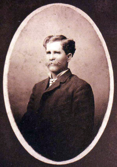 Portrait white man with mustache in suit