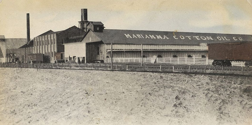 Large building complex with "Marianna Cotton Oil Company" painted onto roof