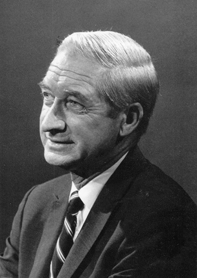 Side view of white man in suit jacket and tie