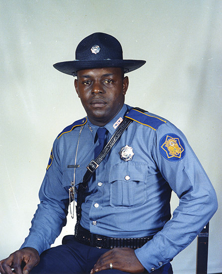African-American man in State police uniform with hat