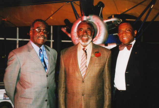 Older African-American men in suits standing together