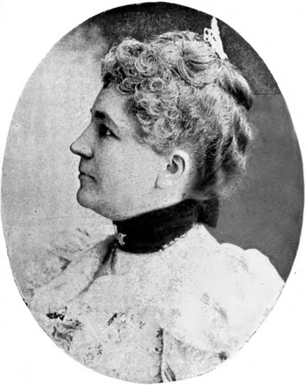 Profile view of white woman with curled hair in dress with collar and hairpin