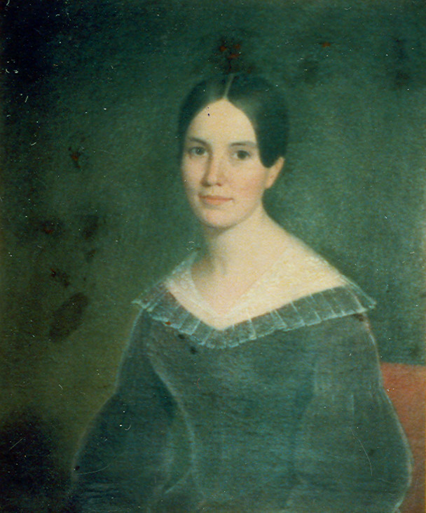 Portrait of white woman in dress with hair pulled up
