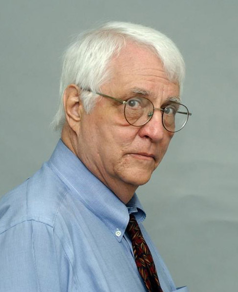 Older white man with glasses in shirt and tie