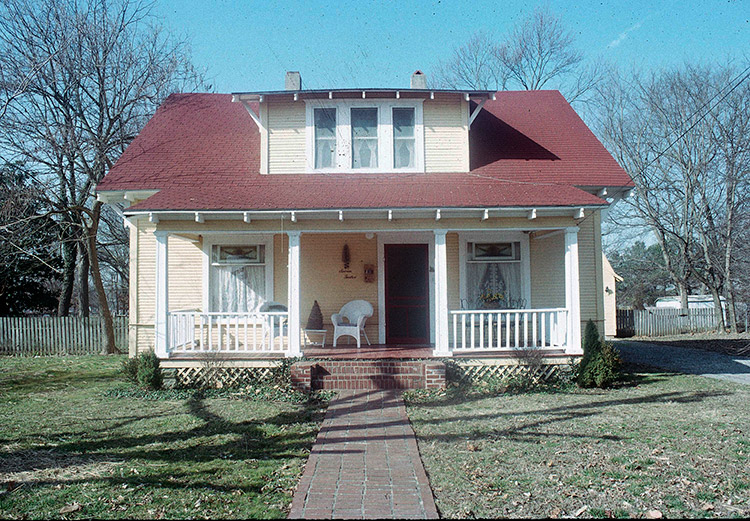 Two-story house with covered porch and front yard