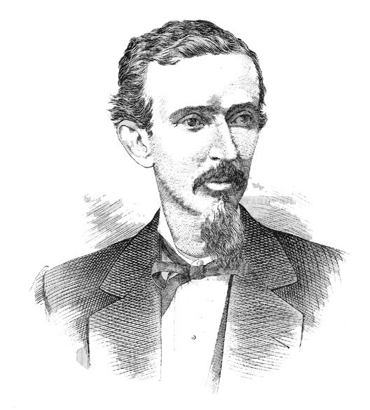 White man with mustache and chin beard in suit and bow tie