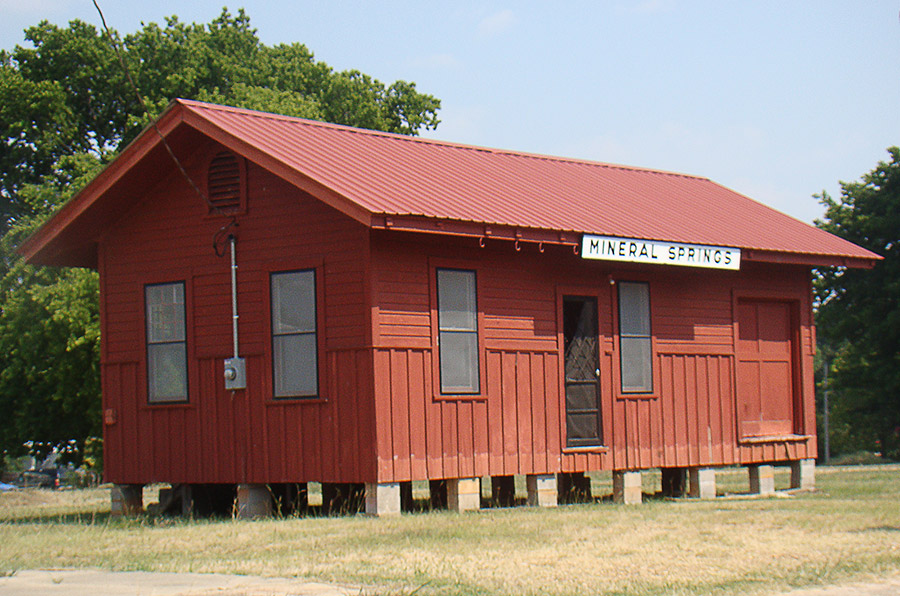 Red "Mineral Springs" depot building on cinder blocks