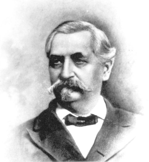 Older white man with thick mustache in suit and bow tie