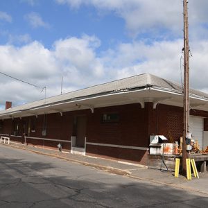 Brick railroad depot building on street