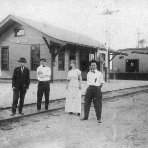 African-American man white men and woman at "Montrose" railroad depot