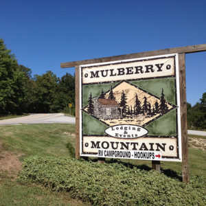 "Mulberry Mountain" sign with street behind it