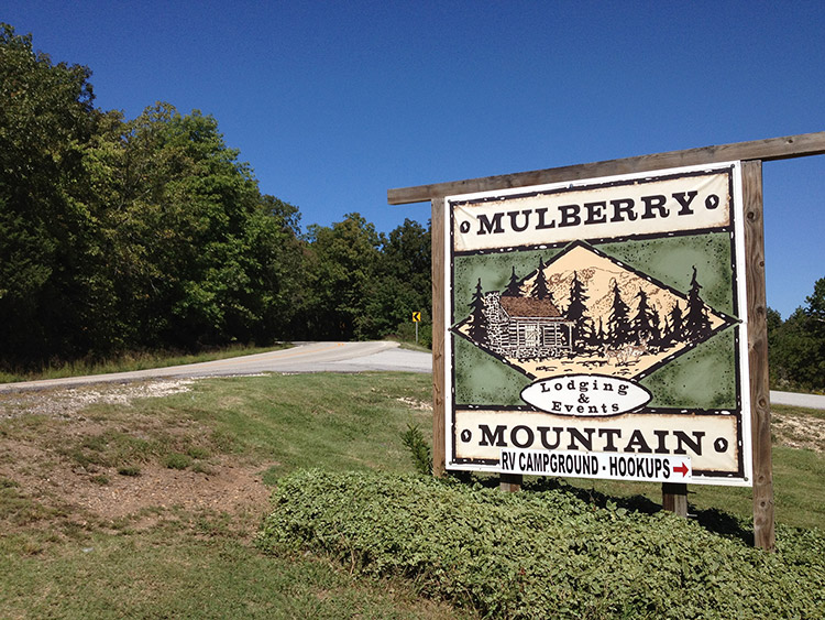 "Mulberry Mountain" sign with street behind it