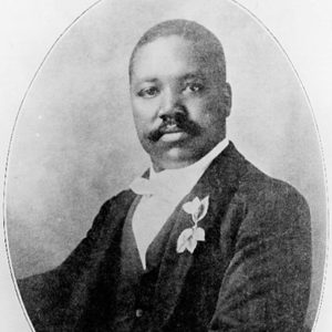 African American man in tuxedo with boutonniere