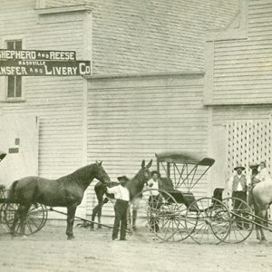 "Shepherd and Reese Transfer and Livery Co" building and men with horses men and horse drawn carriages