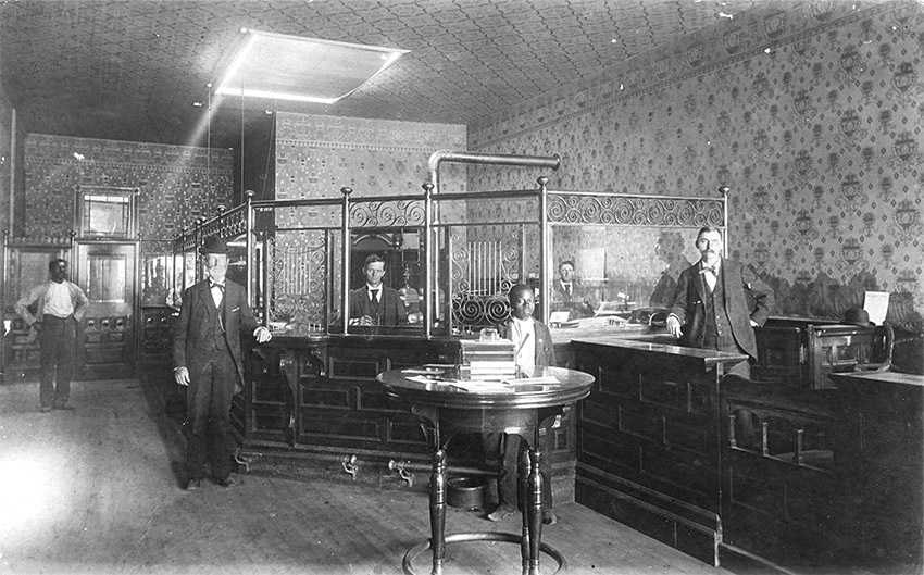 Several men standing in bank