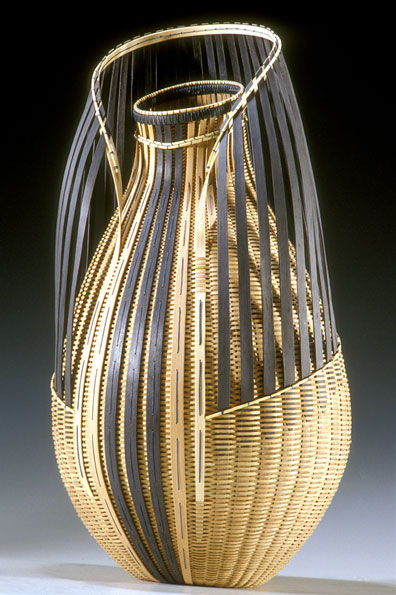 Ornamental straw basket with curved top and black strips