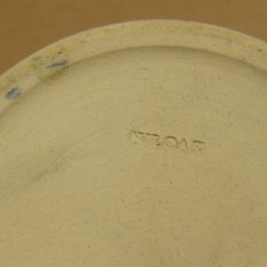 "Niloak" stamp on bottom of pottery