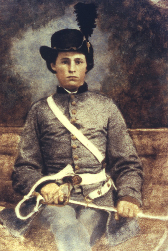 Young white man sitting in gray military uniform with hat and sword in his lap