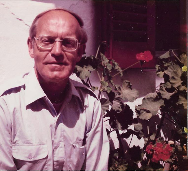 Older white man with glasses in collared shirt