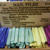 Multicolored nail files on sale in front of wooden "Nail Files" sign