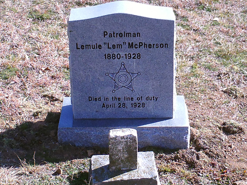 Gravestone with star shield engraved on it in cemetery