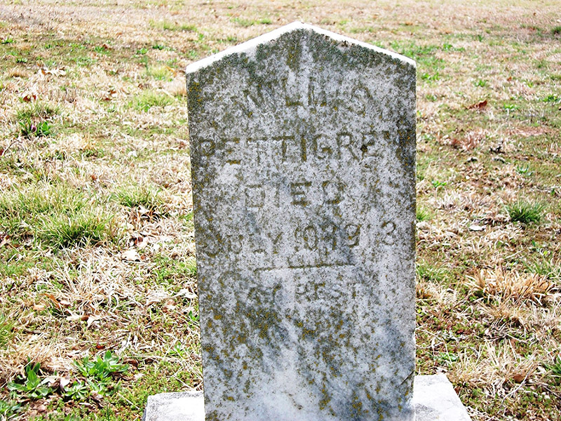 Weathered gravestone in cemetery