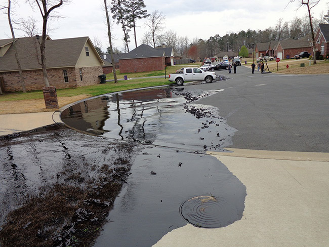 Oil covered driveway and cul de sac in suburban neighborhood