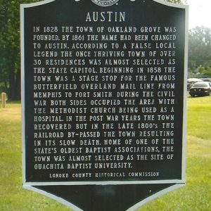 "Austin" historical marker sign on grass