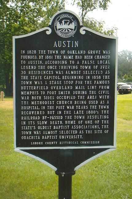 "Austin" historical marker sign on grass