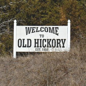 White "Welcome to Old Hickory established 1858" sign on grass