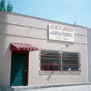 Brick storefront with Quick Wash sign
