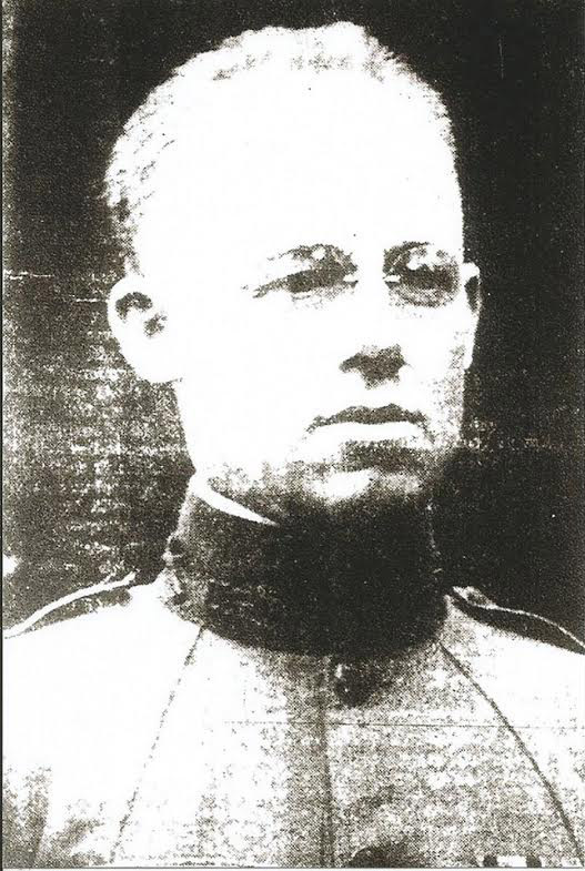 Young white man with glasses in military uniform