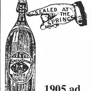 Bottle of water with cartoon hand with "Sealed at the Springs" written on it pointing to the bottle