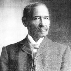 African-American man with a mustache in suit and tie