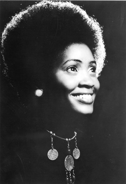 Young African-American woman with afro and necklace