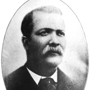 African-American man with a mustache in a suit and striped tie