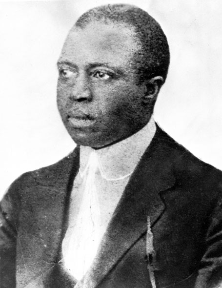 African-American man with short hair in suit