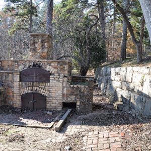 Brick oven and brick wall ruins outdoors