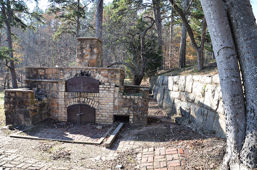 Brick oven and brick wall ruins outdoors