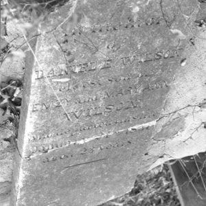 Close-up of weathered gravestone in cemetery