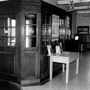 Interior of post office with tables and modern lighting
