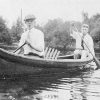 Two white men in canoe on the water