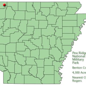 Map of Arkansas with red dot in Benton County and explanation in green text