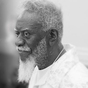 Profile view of African-American man with white hair and beard