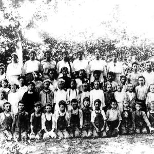 Group of white children and teachers