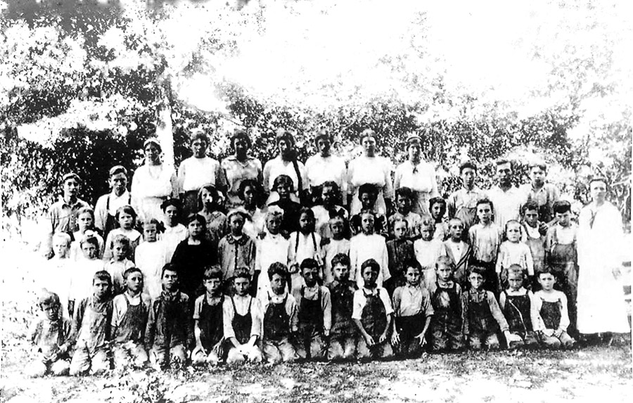 Group of white children and teachers