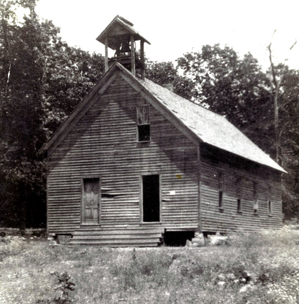 Single-story school house with bell tower