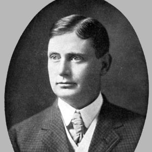 White man in three piece suit and tie