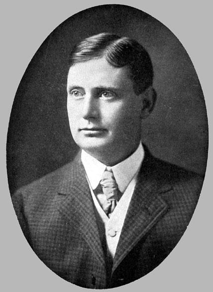 White man in three piece suit and tie