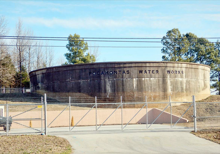 "Pocahontas Water Works" water tank and fence with locked gate